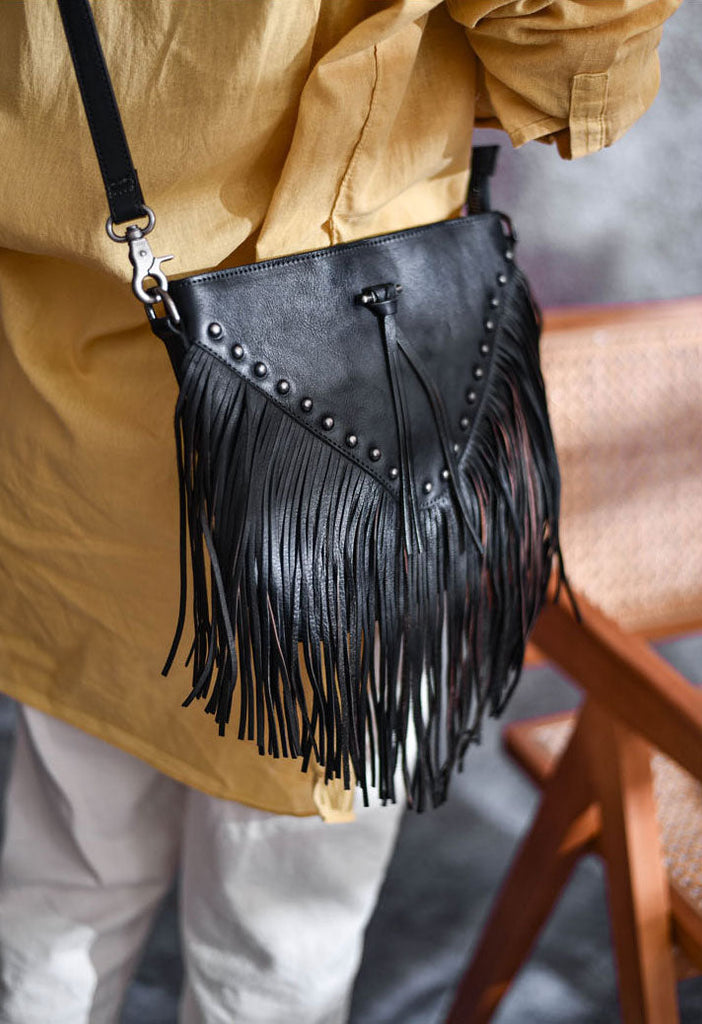 Leather handbag in crescent moon design with tassels beads, gold, black on  Craiyon