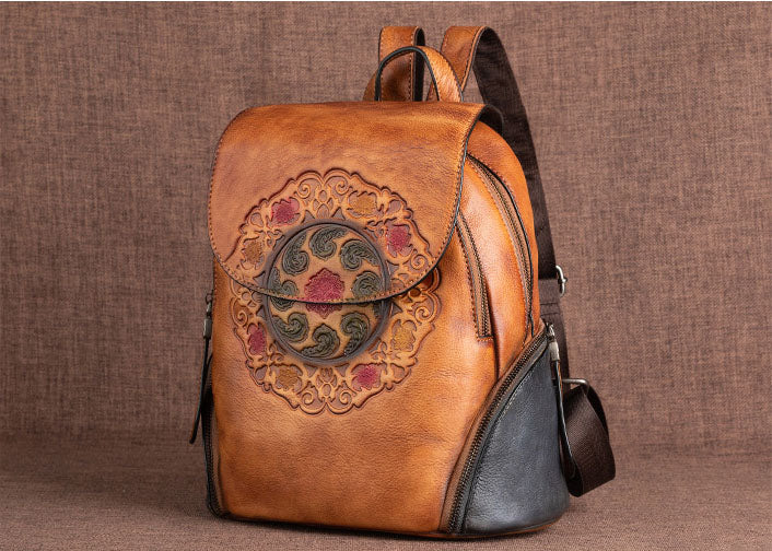 Round leather backpack with all-over embossed eagle
